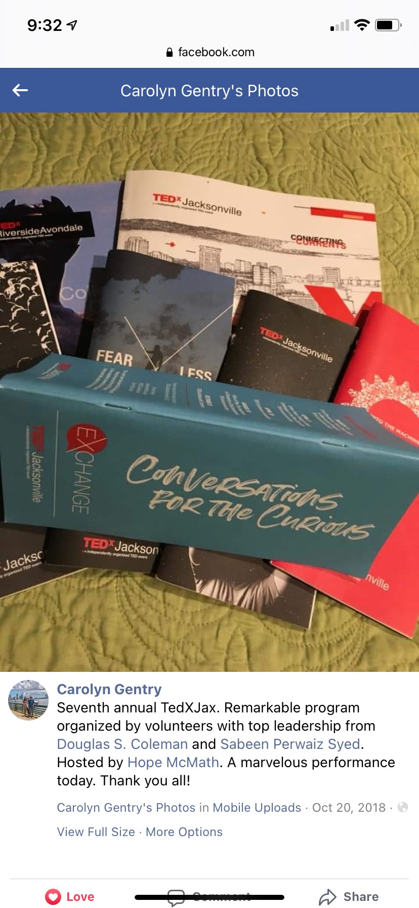 Gentry displays her collection of TEDxJacksonville programs after the 2018 conference.